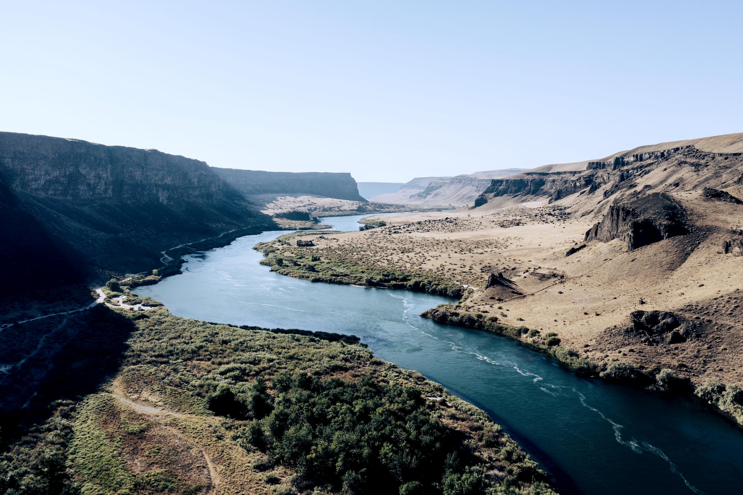 A river winding through a wide canyon