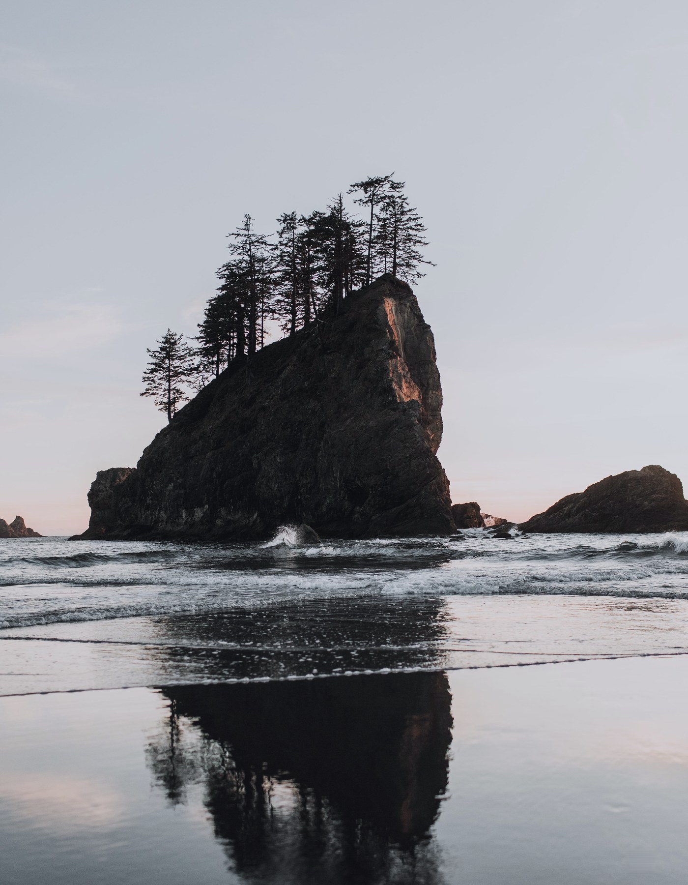 Sea stack off a rocky Pacific coastline